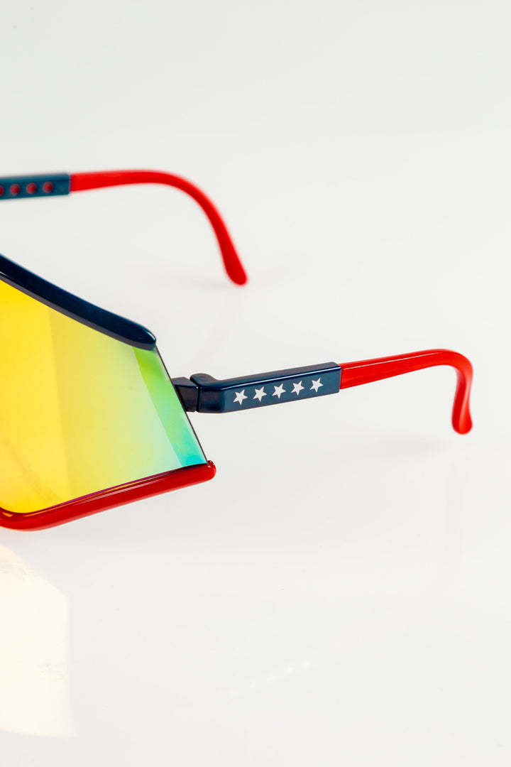 The Cornea Combusters | Red And Blue Revo Retro Macho Sunglasses