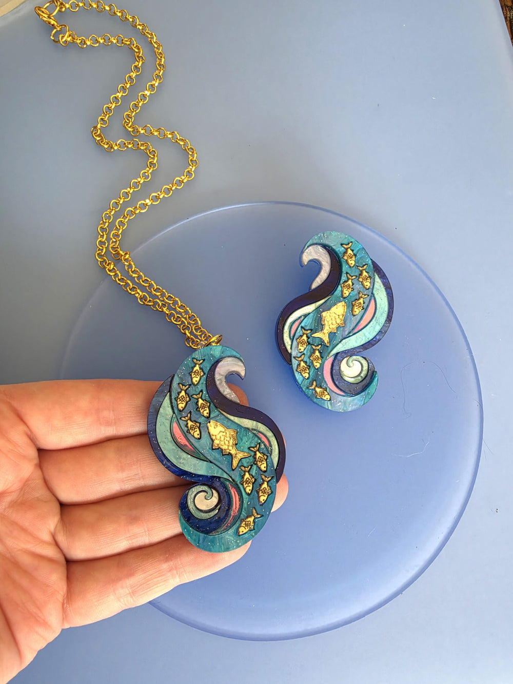 Swimming Against the Current Shoal of Fish Pin or Pendant
