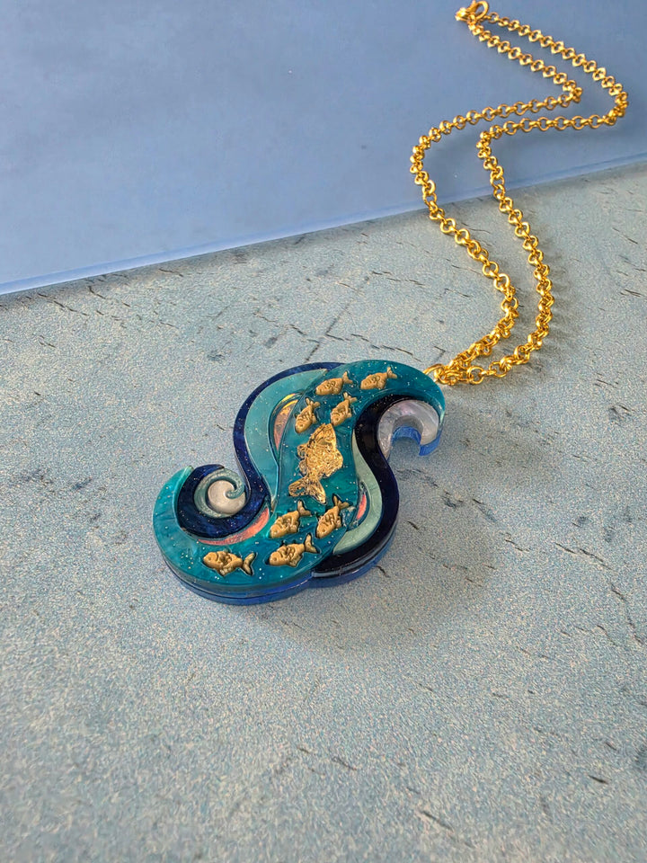 Swimming Against the Current Shoal of Fish Pin or Pendant