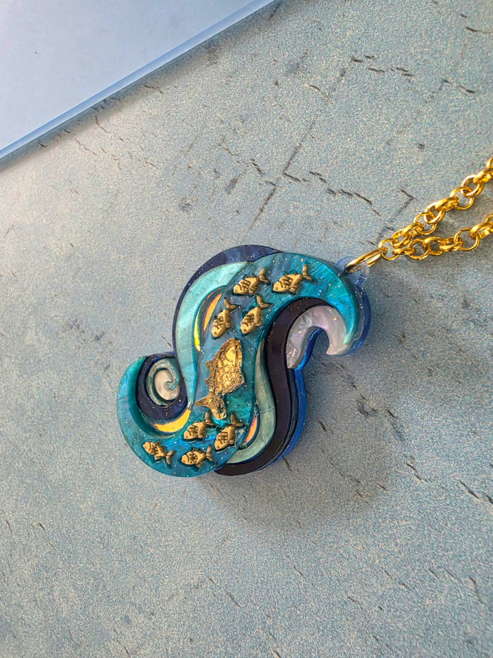 Swimming Against the Current Shoal of Fish Pin or Pendant
