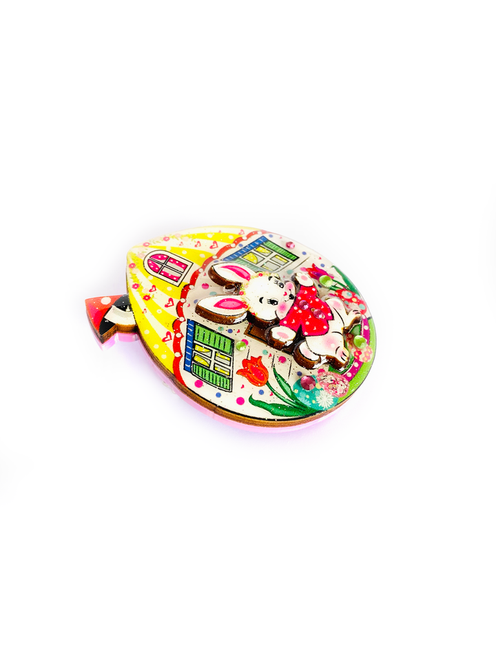 'Bobby the Egg house Brooch' Wonderful 'Bobby the House Brooch' featuring bobby the rabbit in his little egg home, such a pretty kooky unique brooch and stunning for your summer outfit. Brooch basics * measurements 6cm x 6cm. * Stainless steel brooch back&nbsp; Pastel * Perfect for spring * Bunny theme.. great easter gift! 3D effect.