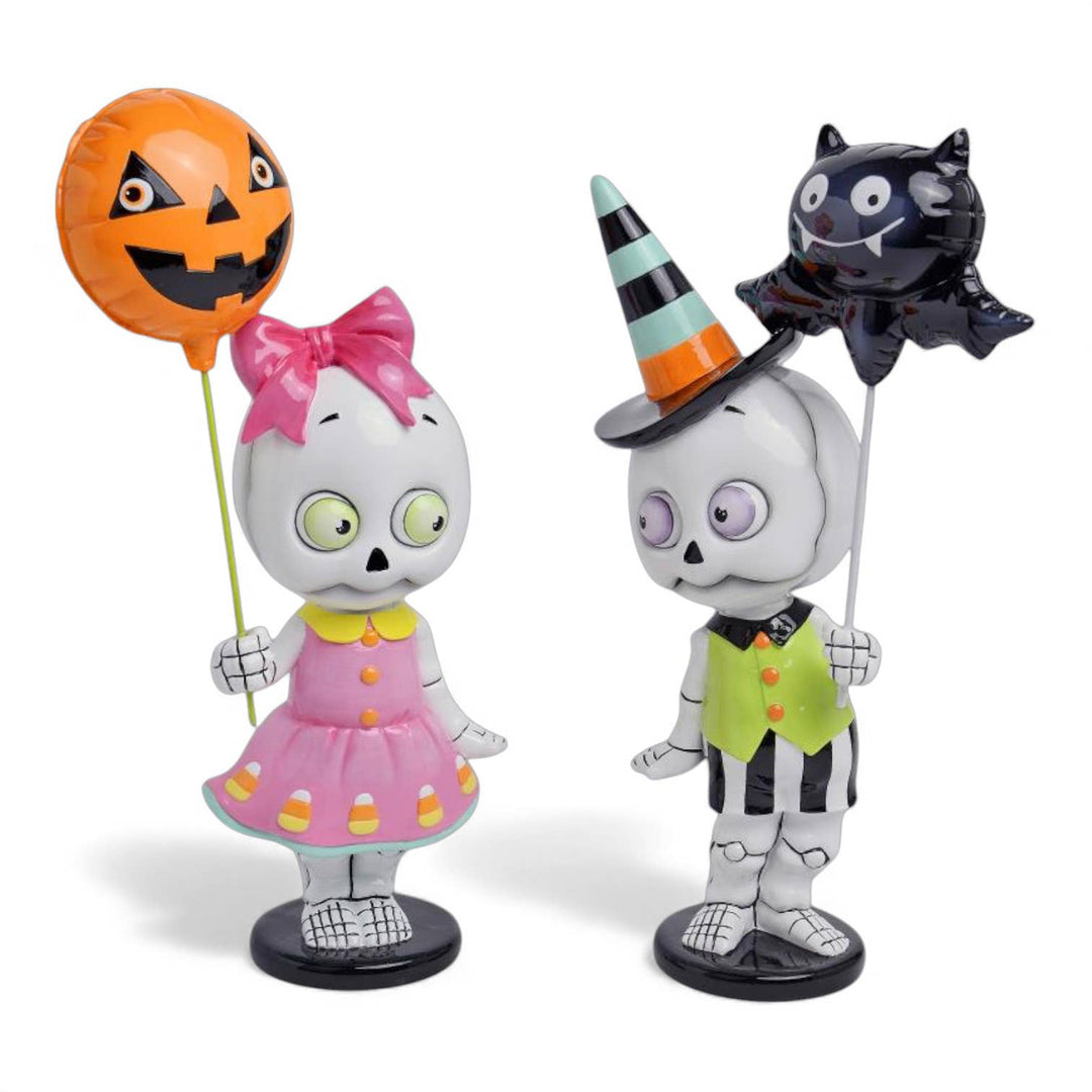 Set of two 13.5 inch skeleton kid figurines by December Diamonds