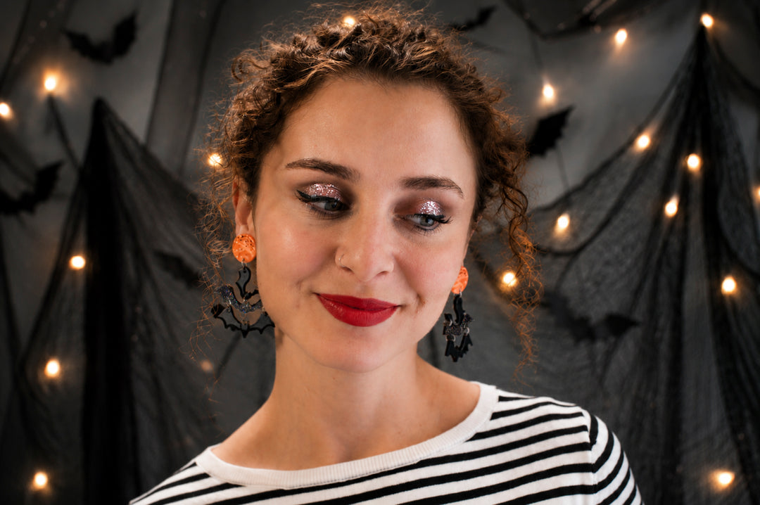 Halloween moon and bats earrings close-up — spooky celestial acrylic jewelry — LaliBlue Midnight Cinema