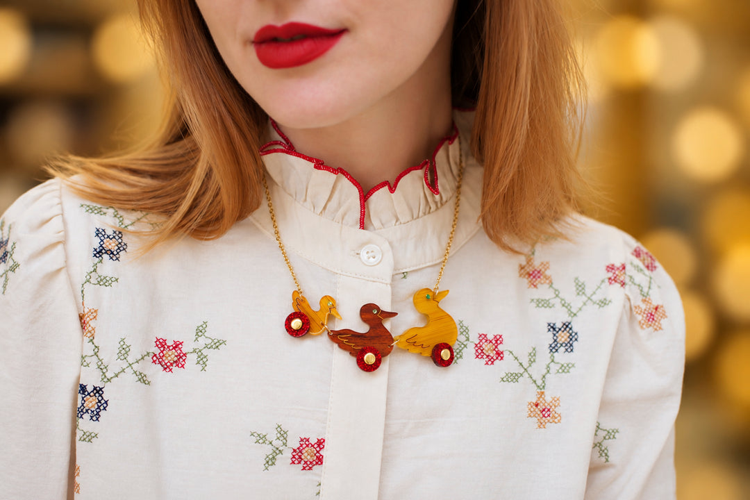 Ducks on wheels necklace detail, LaliBlue Christmas jewelry, ducks, toy
