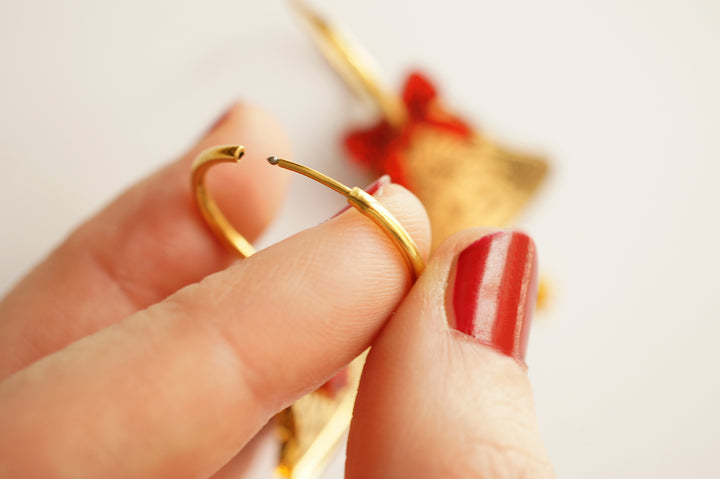 Gold Christmas bell earrings scale view, LaliBlue Christmas jewelry, pre-order