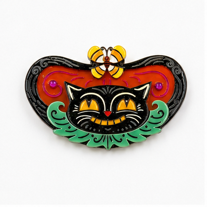 Catcha Candy Corn Butterfly Cat Brooch

Johanna Parker x Lipstick & Chrome

He’s quick. He’s clever. And he’s already caught his prize.

Meet Catcha, a mischievous black cat straight from the Spooky Garden. With his signature grin, glowing candy corn eyes, and a candy corn-winged critter perched above, this limited-edition brooch delivers vintage Halloween charm with plenty of personality.

The wide statement silhouette features 22 individual pieces of layered acrylic, hand-placed rhinestones, and rich dime