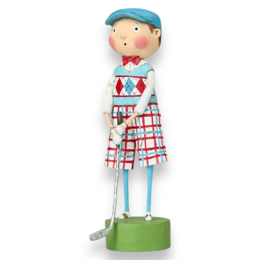 A figurine of a cartoon-style golfer wearing a plaid outfit and a blue hat, holding a golf club, on a green base.