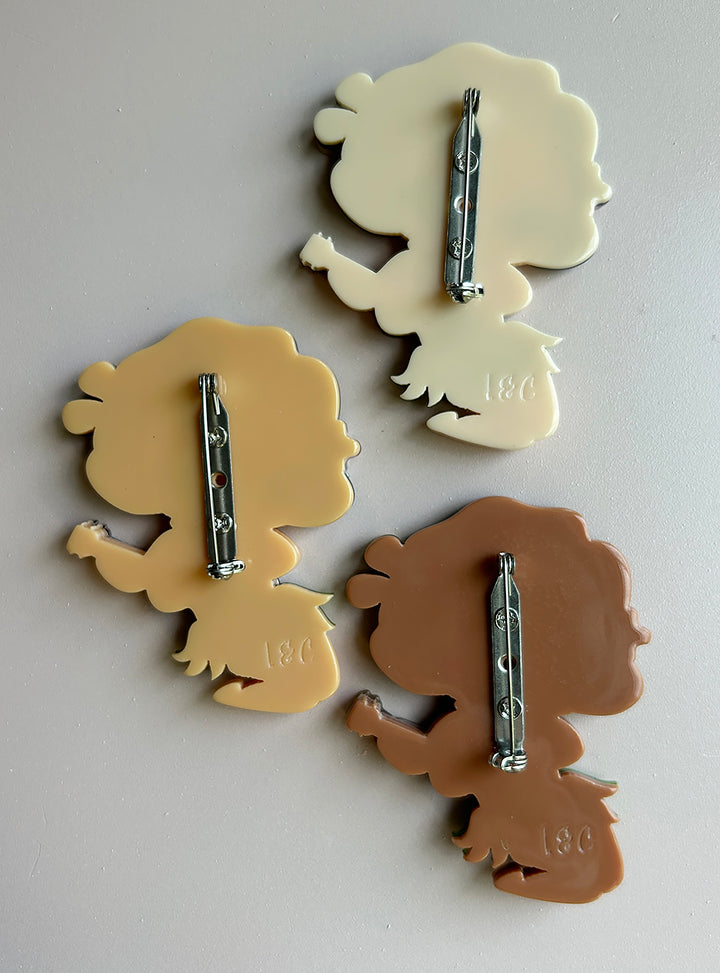 Hula Girl brooches by Miss Fluff and Lipstick and Chrome featuring  locking clasps on the back.