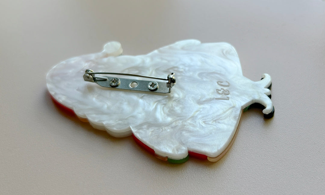 Photo featuring the locking clasp on the Jolly Old Elf Christmas brooch by Johanna Parker and Lipstick & Chrome. Holiday Santa pin.