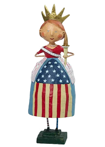 Decorative figure of a girl in an American flag dress with a crown on a light background