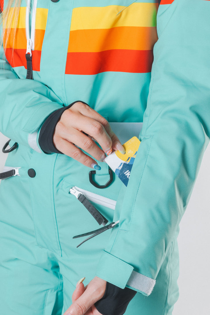 The Midday Aprés | Teal and Orange Retro Stripe Women's One Piece Ski Suit