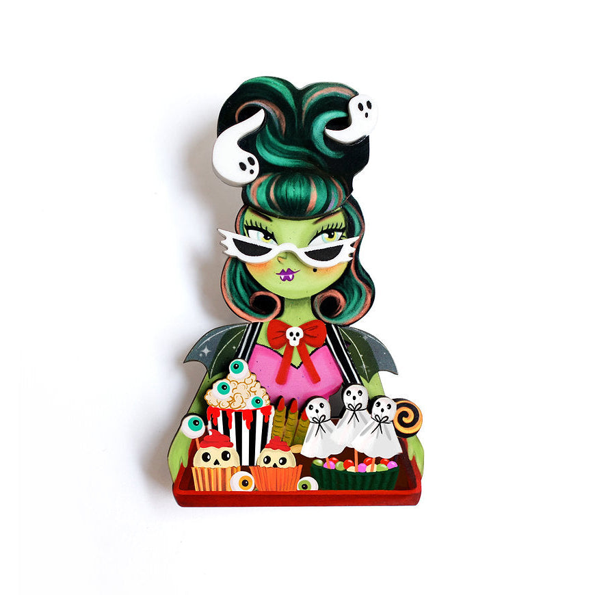 Colorful figurine with green hair and white face on a white background