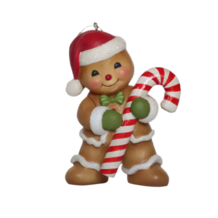 Bethany Lowe gingerbread boy ornament  with a Santa hat, green bow tie, and holding a candy cane.