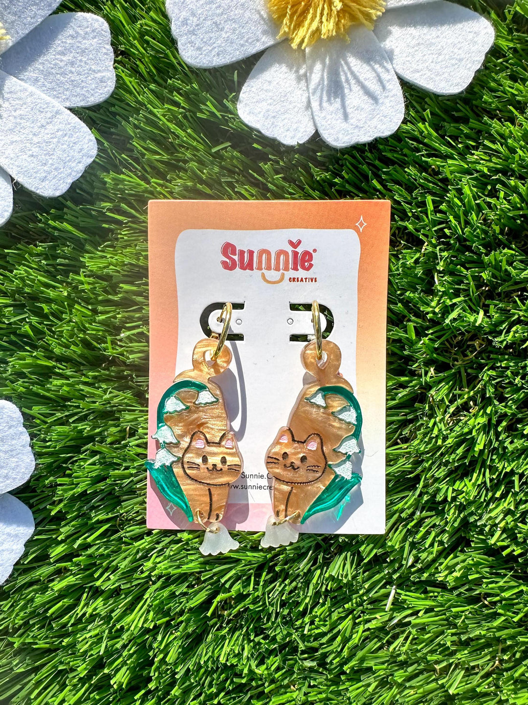 Orange Cat with Lily of the Valley Flower