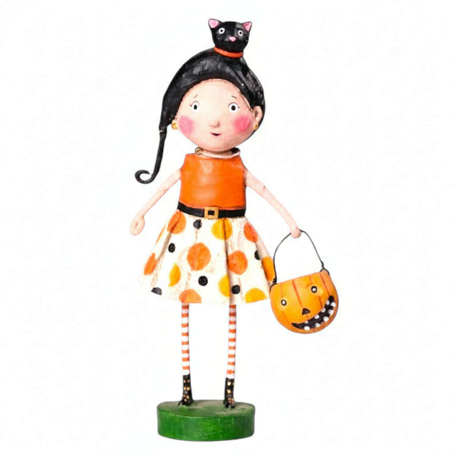 Halloween-themed figurine of a girl with black hair, orange dress, and pumpkin bucket  kit kat lori mitchell halloween