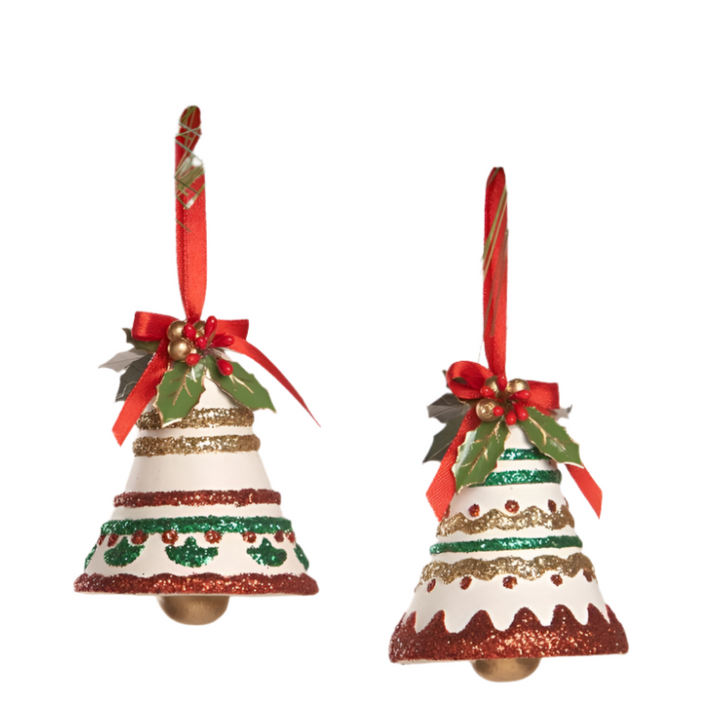 Two white Christmas bell ornaments with red and green glitter decorations, holly leaves, berries, and red ribbon bows.