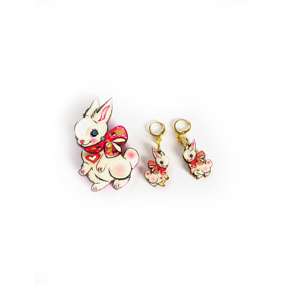 'Layla the magical bunny brooch' Welcome the lovely little Layla bunny brooch! Shes so magical and adorable with the little heart and prety scarf. Perfect for easter. Brooch basics * measurements 7cm x 5cm. * Certified woods/lasercut. * Stainless steel brooch back * Illustrated inhouse. * Resin cured. * Pastel * Perfect for spring * Bunny theme.. great easter gift!