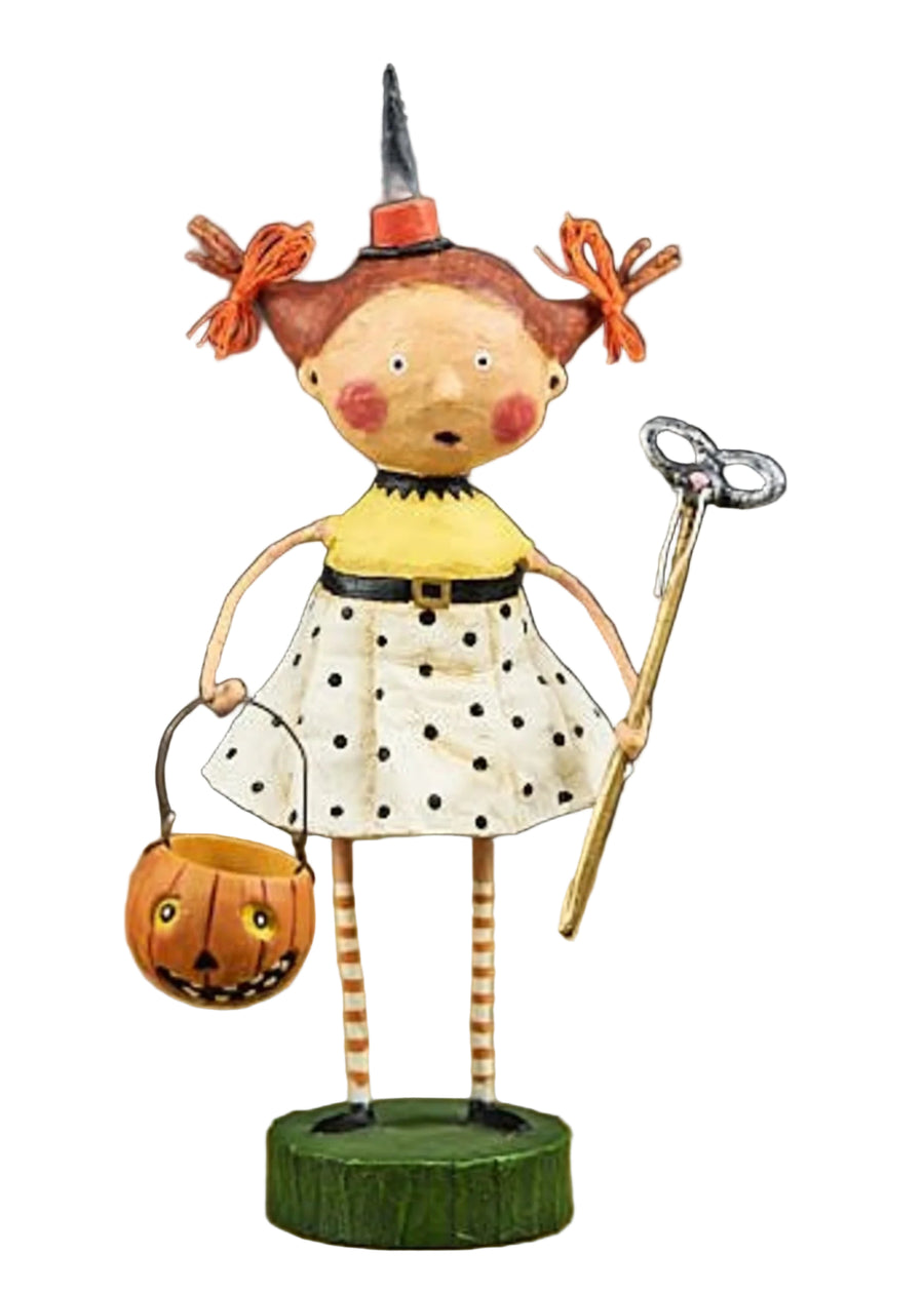 Halloween-themed figurine of a girl with red hair, black hat, and pumpkin basket on a neutral background.