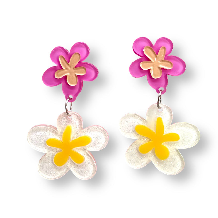 Flower-shaped earrings with pink top and yellow and white bottom miss fluff
