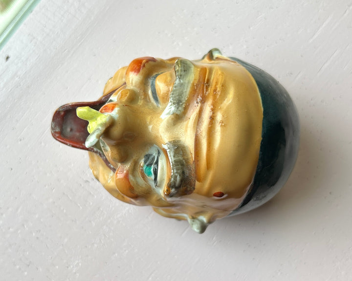 Old man ashtray detail