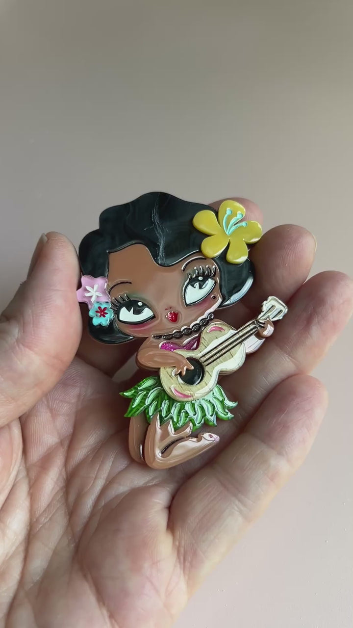 Hula Girl brooch by Miss Fluff and Lipstick and Chrome featuring multiple acrylic layers and a locking clasp on the back.