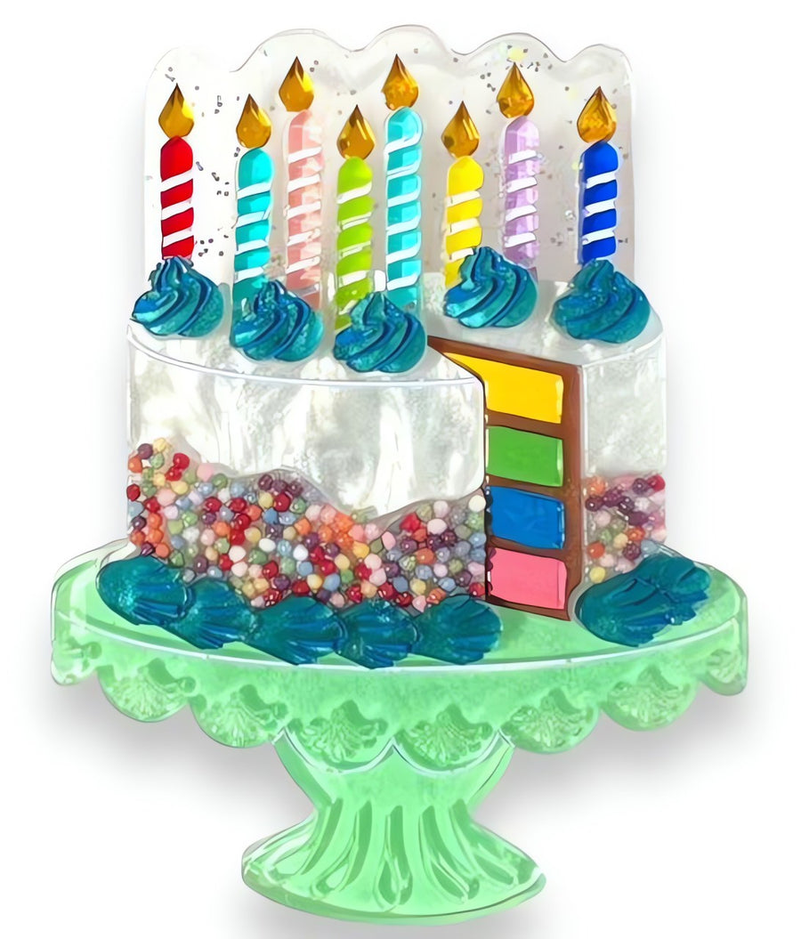 Colorful birthday cake brooch with candles and sprinkles