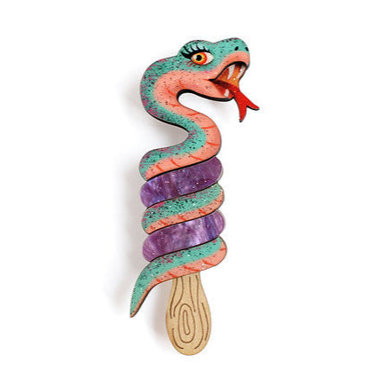 Brooch inspired by the classic two-flavor twist ice cream, but with a special twist!

Our coiled snake invites you to add a playful touch to your look.

-Made of wood and pearl-effect acrylic in lilac color

 -Safety pin with safety closure on the back

 -Size: 8 x 2.5 cm


 Original illustration and design by LaliBlue.