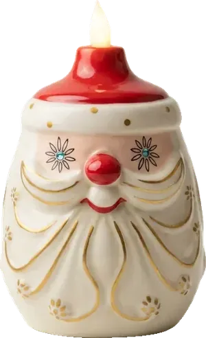 Starry Eyed Santa Candle-Lite: cream ceramic Santa with starry eyes, cherry nose, gold beard and a glowing candle
